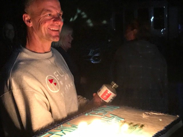 A man holding a cake