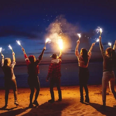 A group of people holding a mini torch